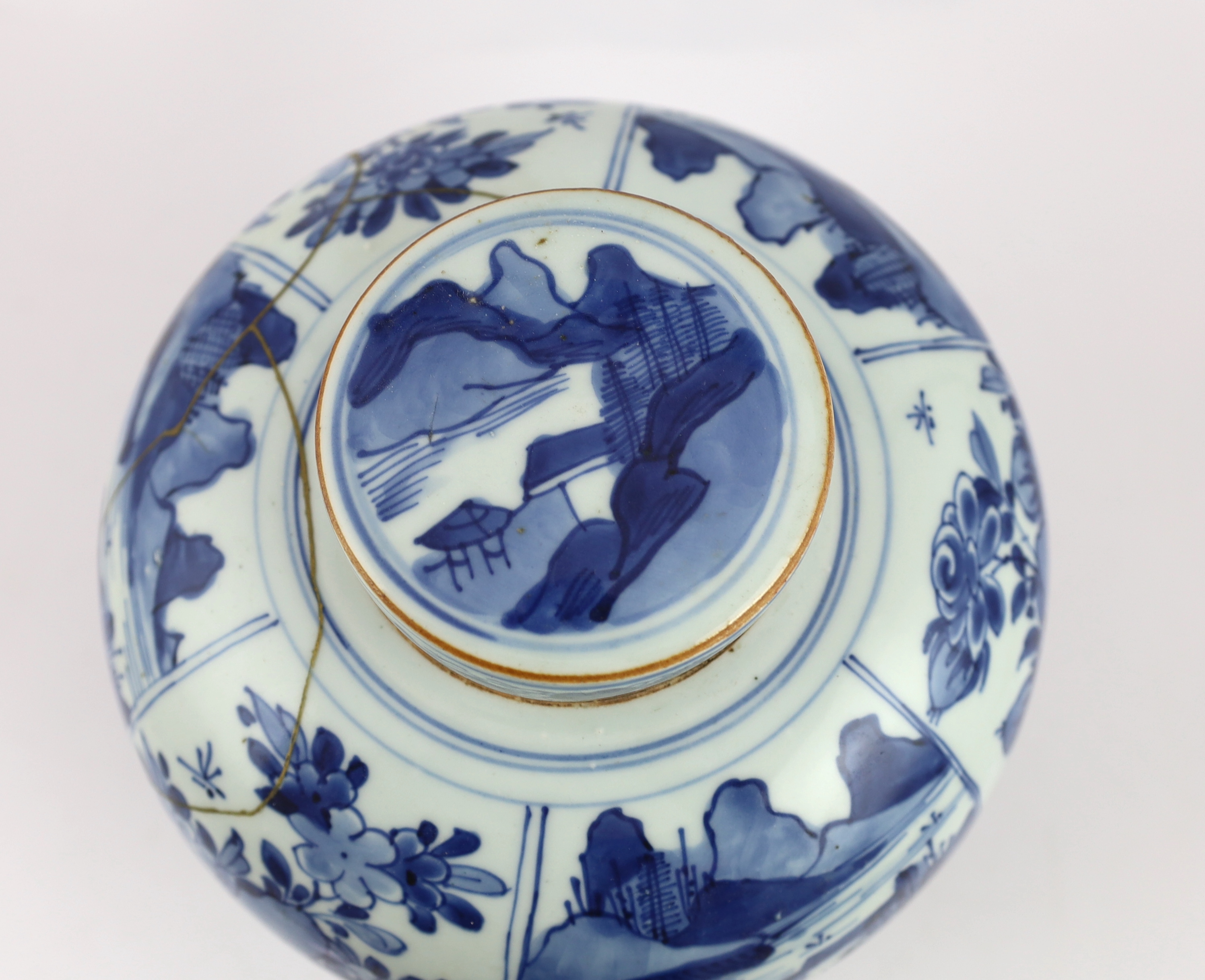 A Chinese blue and white ovoid jar and cover, Kangxi period, broken with kintsugi repair